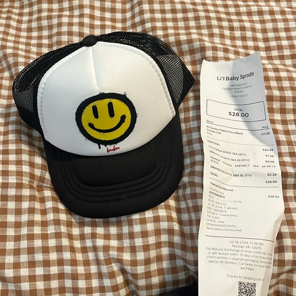 Baby boy smiles trucker hat